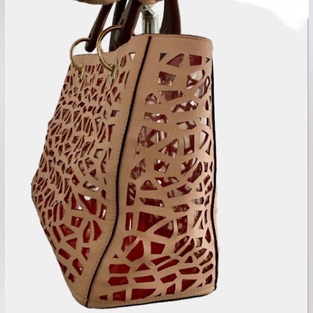 Pink Laser cut faux leather tote.